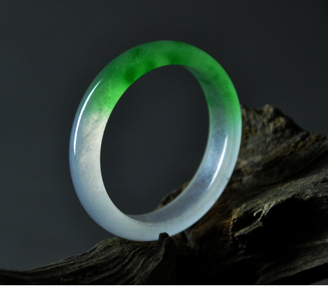 A translucent green and white jadeite bangle (1 of 6)
