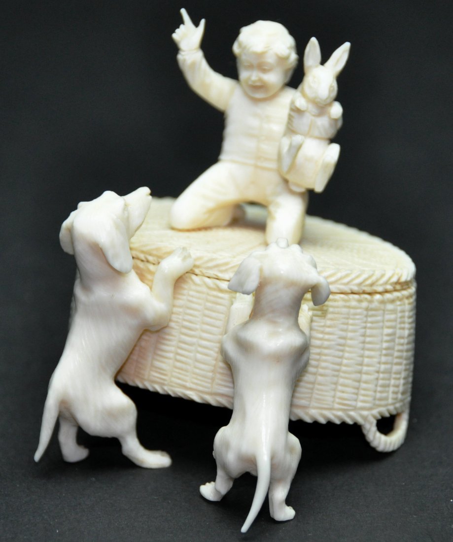 A carving of a boy and two dogs (1 of 8)