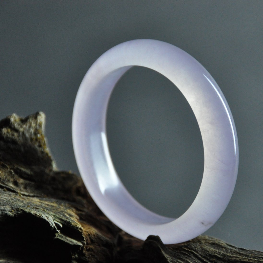 A translucent purple jadeite bangle (1 of 7)