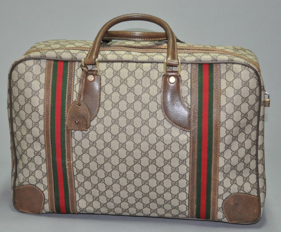 A GUCCI vintage monogram canvas leather travel bag (1 of 5)
