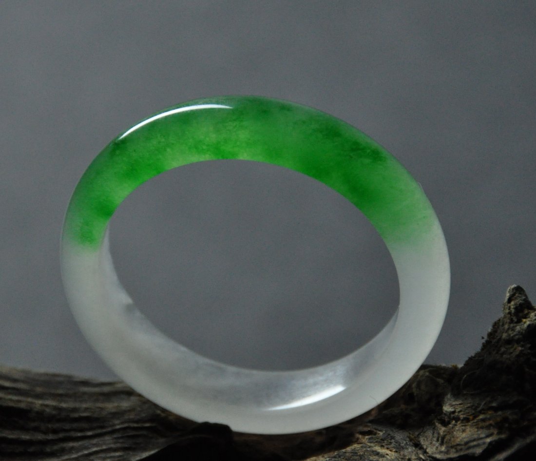 A translucent green and white jadeite bangle (1 of 5)