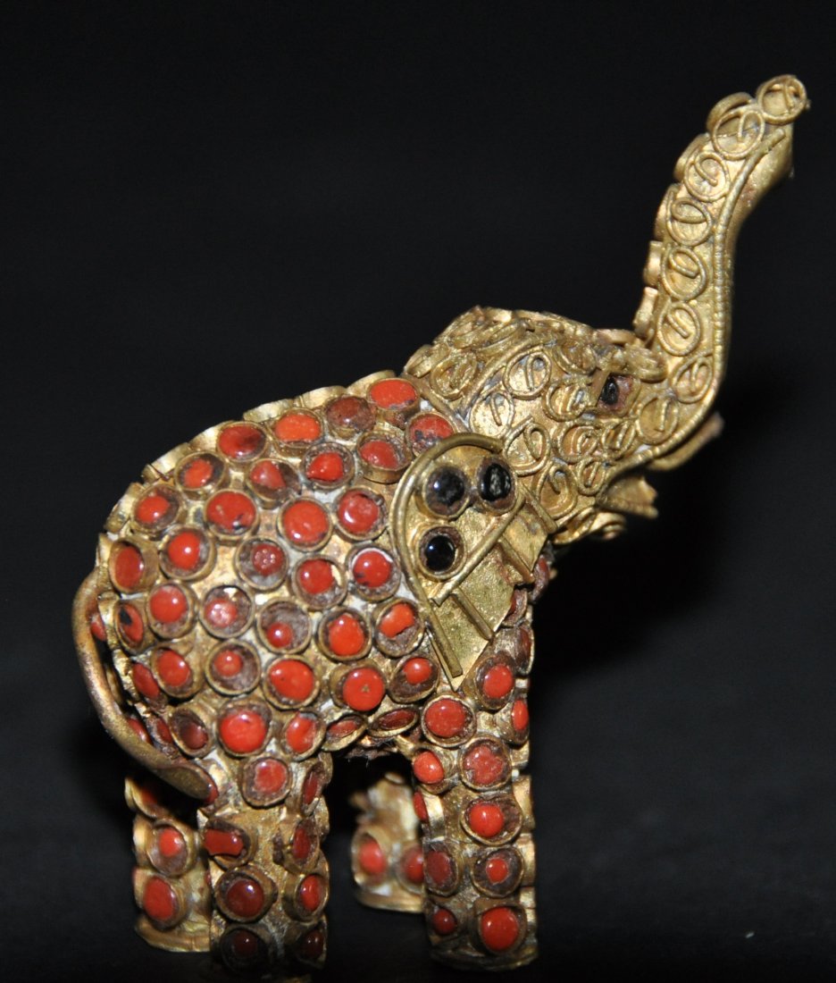 A gilt-bronze studded elephant figure (1 of 6)