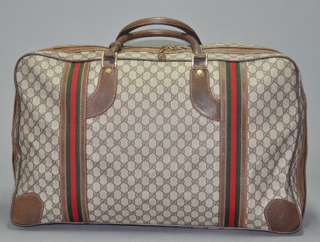 A GUCCI vintage monogram canvas leather luggage bag (1 of 7)