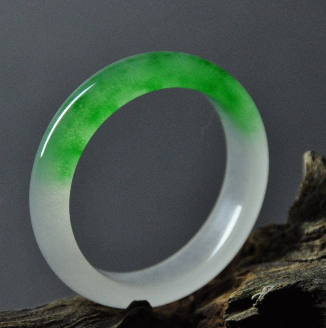 A translucent green and white jadeite bangle (1 of 5)
