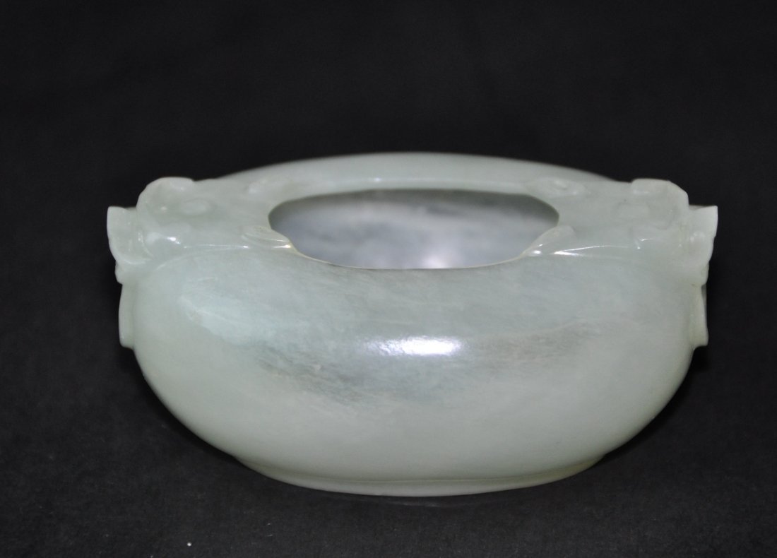 A Hetian white jade washer: A Hetian white jade washer. Height 3.5 cm. Length 7.4 cm.Width 4.8 cm.