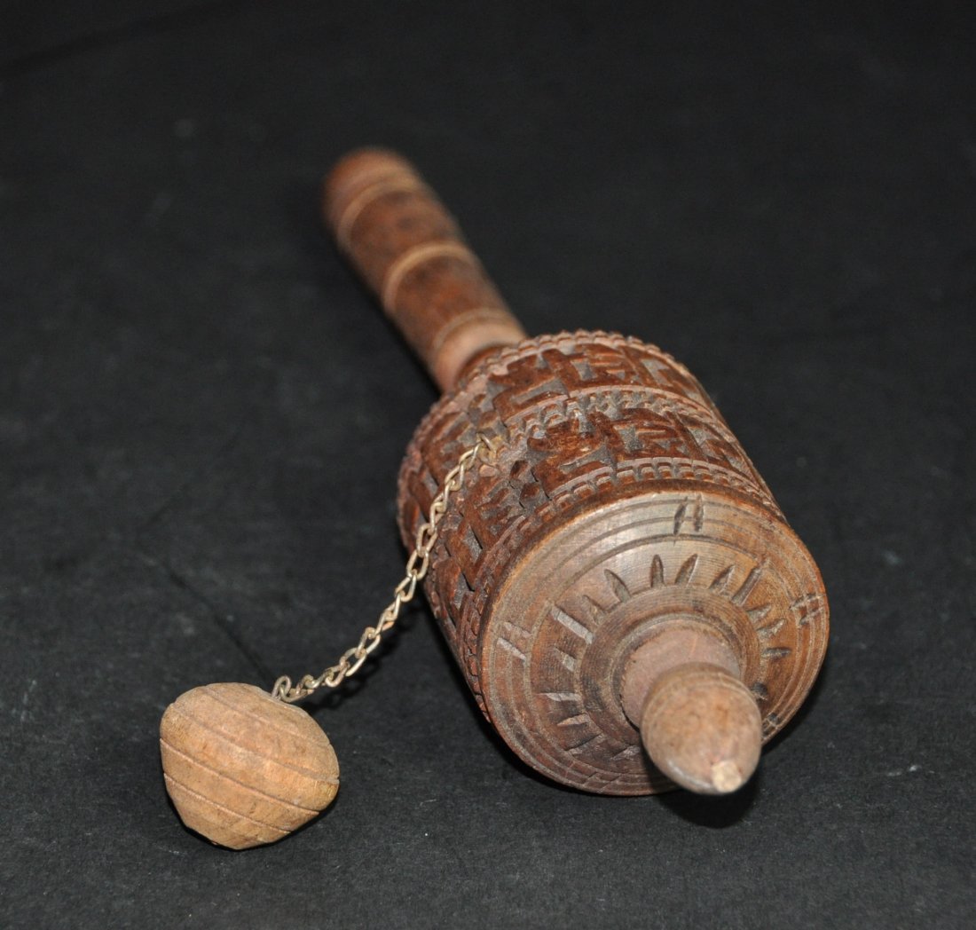 An Antique Tibetan wood Himilayan pryer wheel: Tibetan wood Himilayan pryer wheel.Height 26 cm.Diameter 5.5 cm.