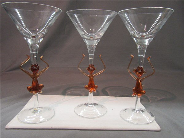Murano Monkey Martini Glasses: A set of 3 Murano martini glasses with figural monkeys. Dimensions: 9" X 4"