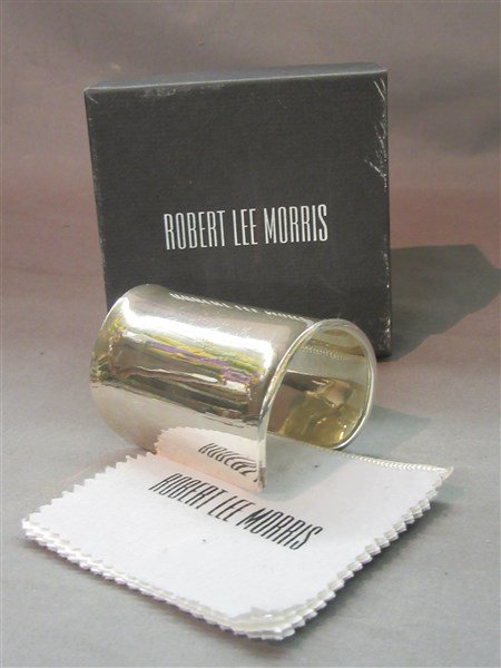 Robert Lee Morris Designer Sterling Silver Cuff: A fine Robert Lee Morris designer sterling silver cuff bracelet. Original box and polish cloth. Dimensions: 3 1/2" X 3"t.w.: 4.3 avg. oz.