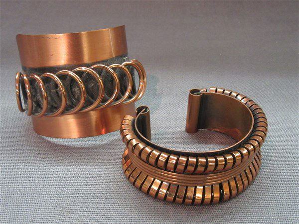Two (2) Vintage Copper Cuff Bracelets: Two (2) vintage copper cuff bracelets. One being signed Renoir.