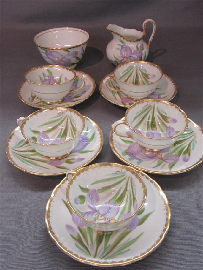 Tuscan Handpainted Cups & Saucers Set: Tuscan fine bone china. Hand painted Lillies by F.Bailey. Five (5) cups and saucers, sugar and creamer.