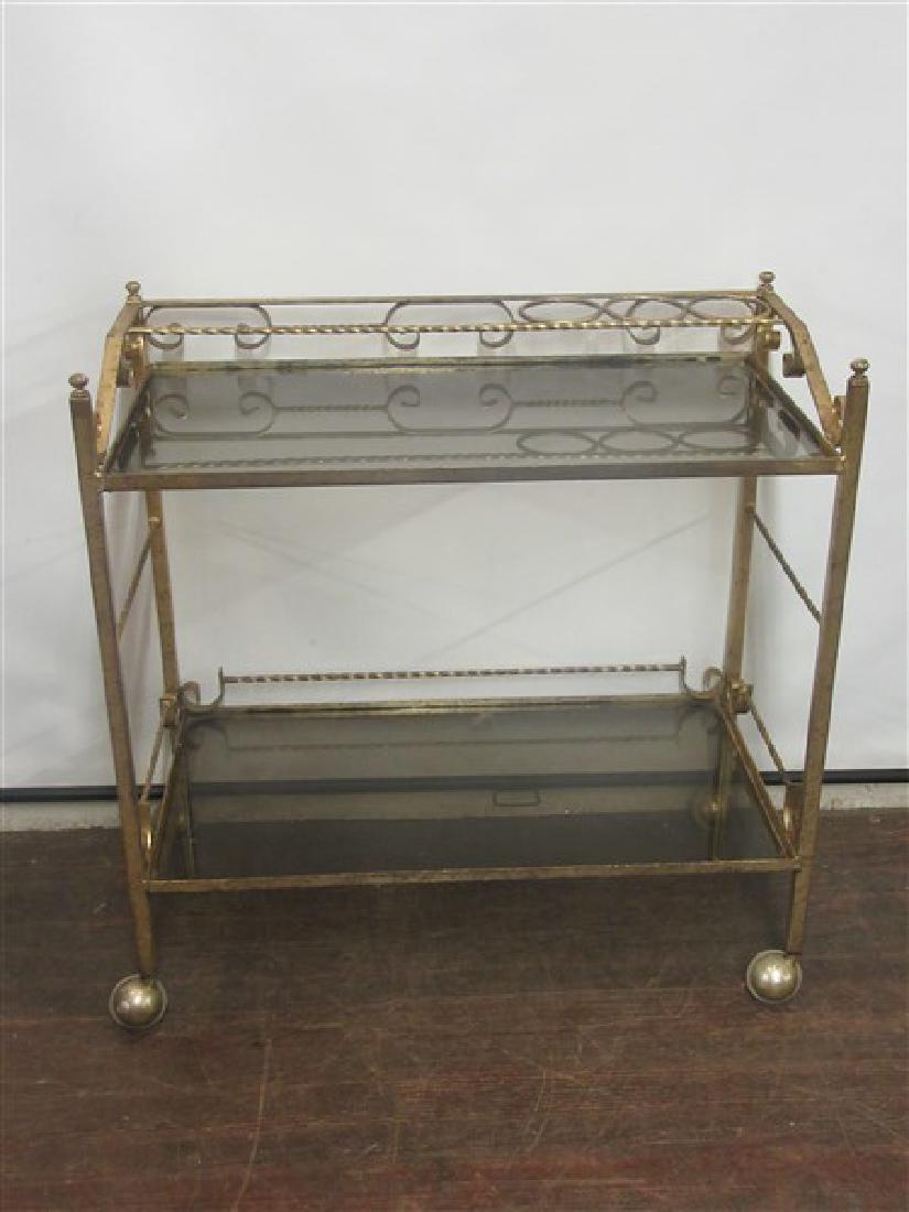 1960's Bar Cart: A 1960's Iron bar cart with gold finish. Dimensions: 33" X 32" X 16"