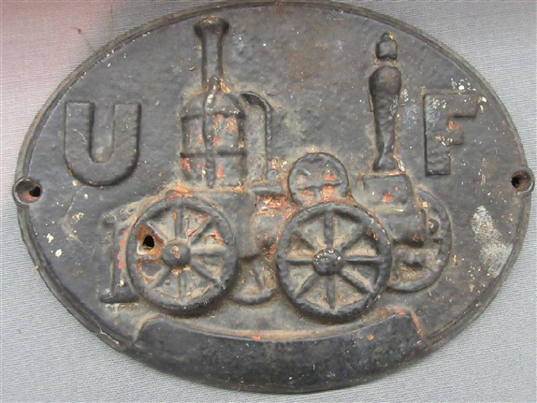 Cast Iron Firemark, United Fireman's Insurance, Philla: An antique cast iron firemark. Made for United Fireman's Insurance, Philadelphia PA. Original.Dimensions: 11 1/2" X 9"