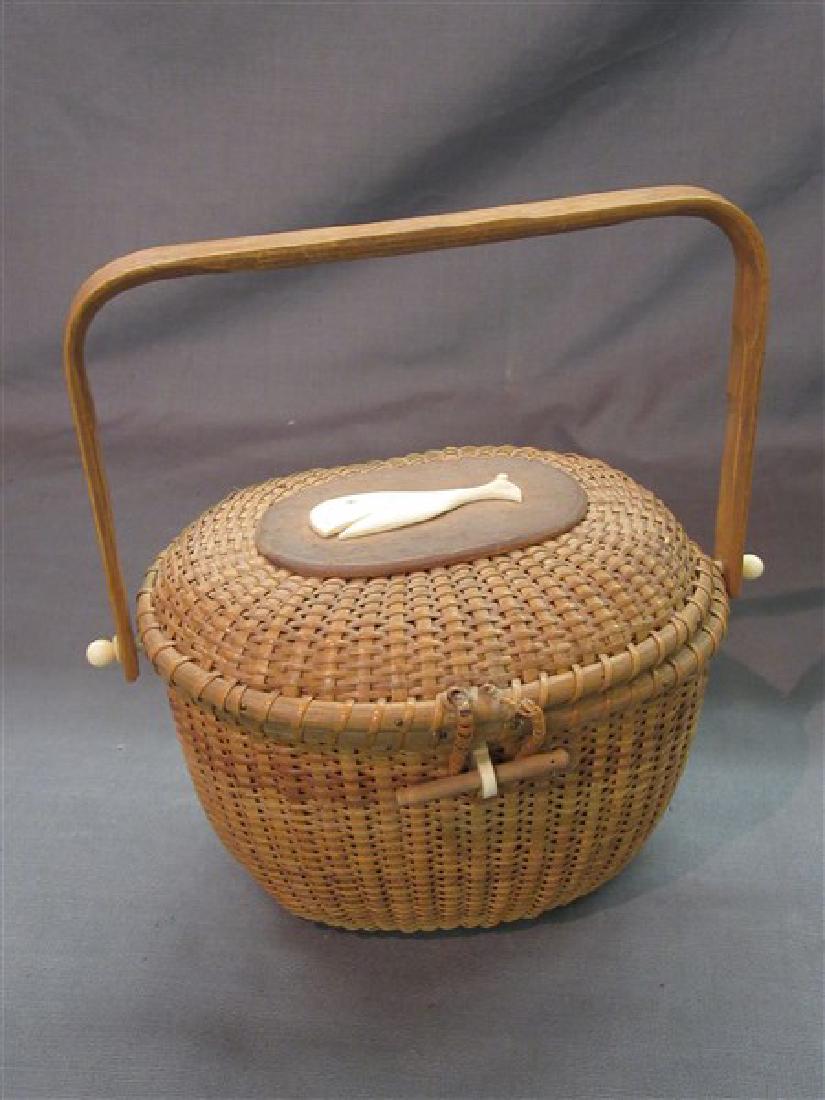 Vintage Nantucket Basket: A vintage Nantucket basket with whale bone applied decoration. Dimensions: 7 1/2" X 8 1/2" X 7"
