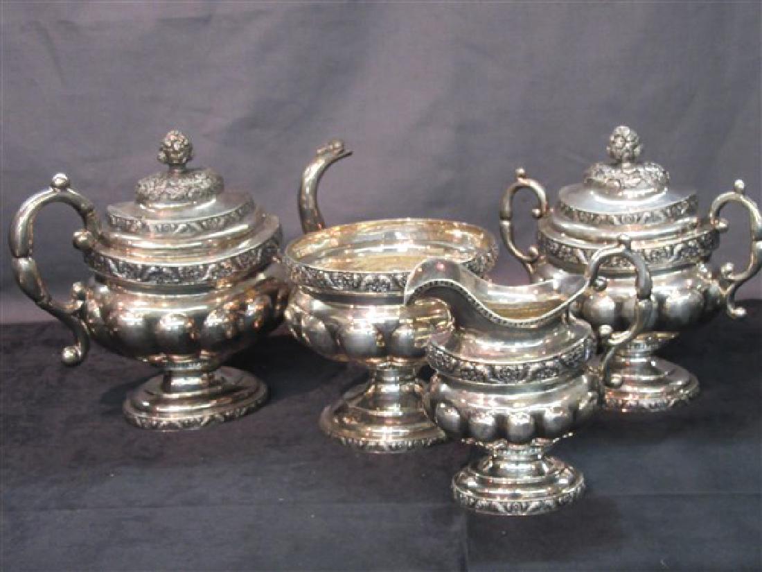 American Coin Silver Tea Service, John Crawford: Four (4) Piece American Coin Silver Tea Service.Signed J. Crawford for John Crawford, New York and Philadelphia 1815-1841. Teapot: 9 1/2"h X 12"wCovered double handled sugar bowl: 9" X 10"Creamer: 7"