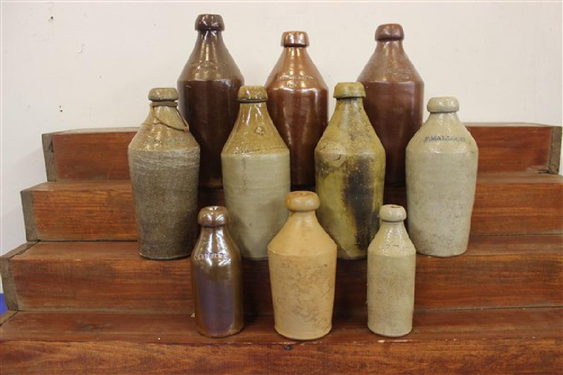 10 Stoneware Bottles: Ten (10) Stoneware bottles. Gardner, H. F. Clark, Potter & Dunham, James Harrison, J. A. Wallis, F. Malloch, F. G. Brackott, Baker & Blodgett