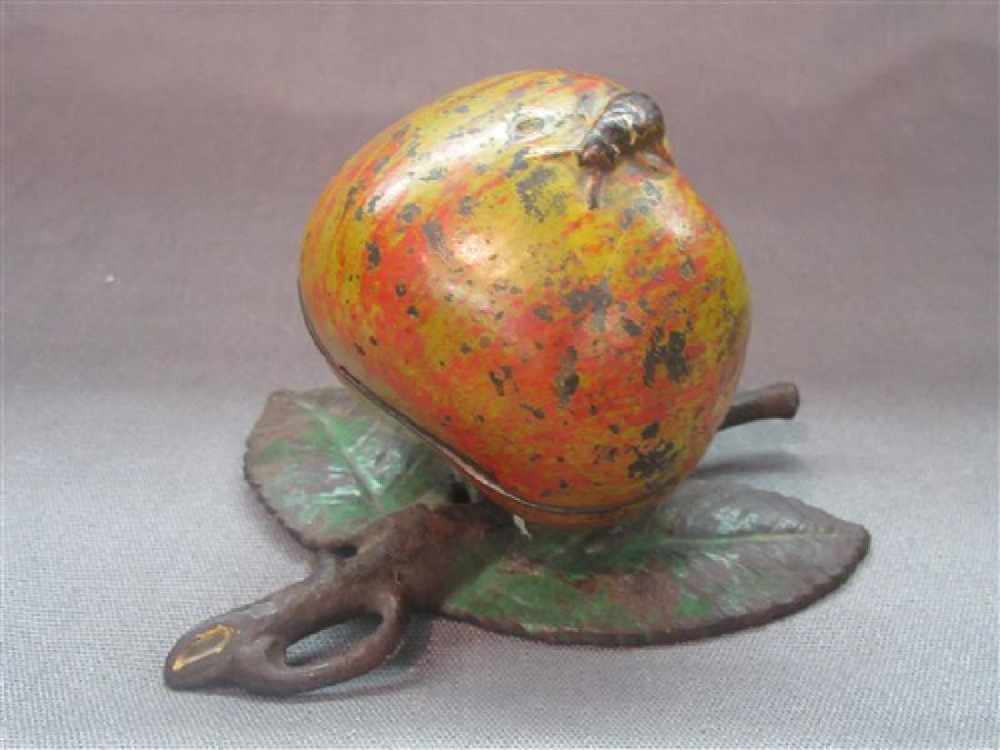 Early Cast Iron Apple Still Bank: "Apple" Still Bank. This cast iron bank measures 5-1/2" wide and 3-1/2" tall. Made by Kyser & Rex, Late 19th c. Original paint on apple and leaves.
