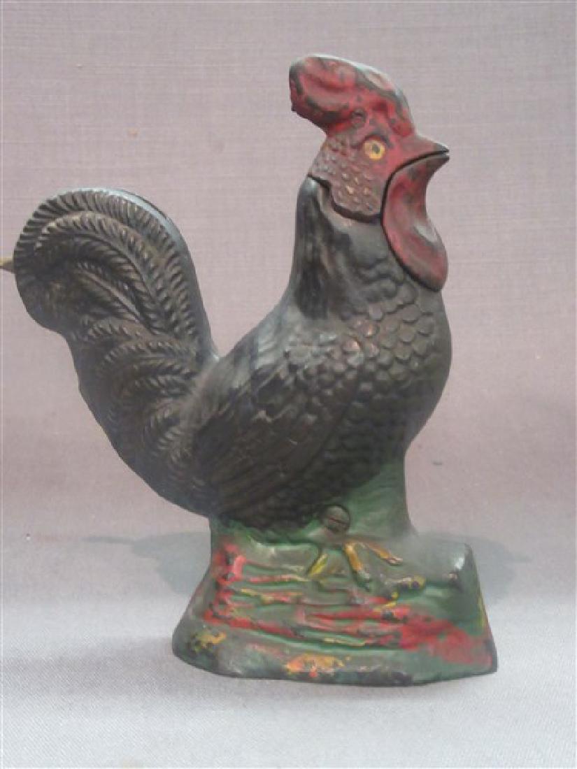 Mechanical Rooster Bank: Made by the Kyser & Rex Company Philadelphia, Pennsylvania - Circa 1880. The rooster moves his head when lever is depressed and coin is deposited. Dimensions: 6 1/2" X 5"