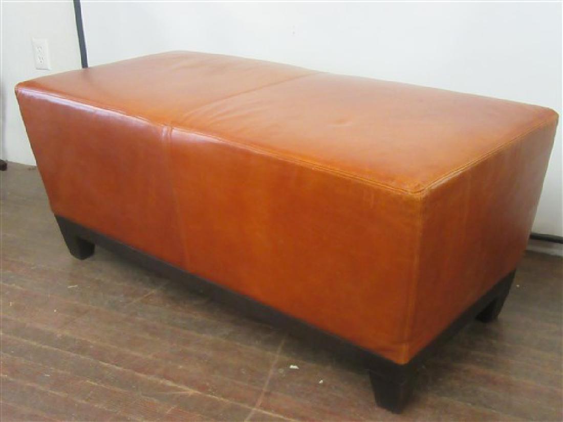 Oversized Brown Leather Ottoman: An oversized brown leather ottoman. Contemporary. Dimensions: 21"h X 50"w X 24"d