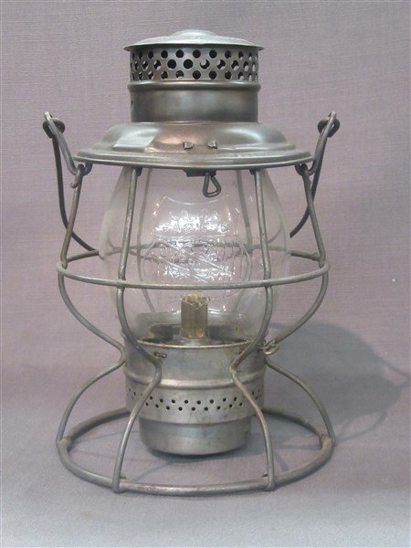 Adams & Westlake Union Pacific Lantern Embossed Globe: An Adams & Westlake Union Pacific railroad lantern with embossed Union Pacific shield logo on globe. Dimensions: 16" X 8" approx.