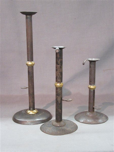 Three Hog Scraper Candlesticks: Three (3) Hog scraper style candlesticks. Dimensions: 14 1/2" tallest height.