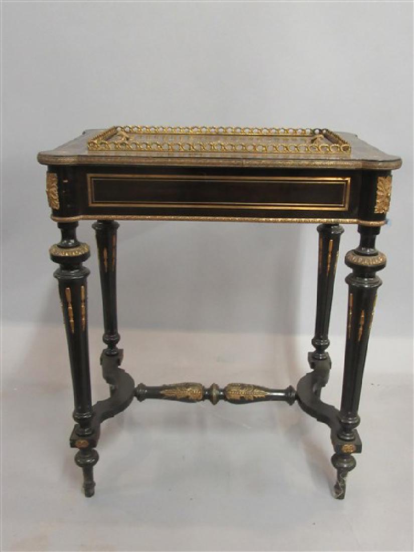 Napoleonic Ebonized Gilt Wood Console Table: A Napoleonic ebonized console table. 19th century with inlaid top decorated with inlaid vase with surrounding florals. Top lifts off to reveal a 5" depth cavity that probably housed a flower arrangeme