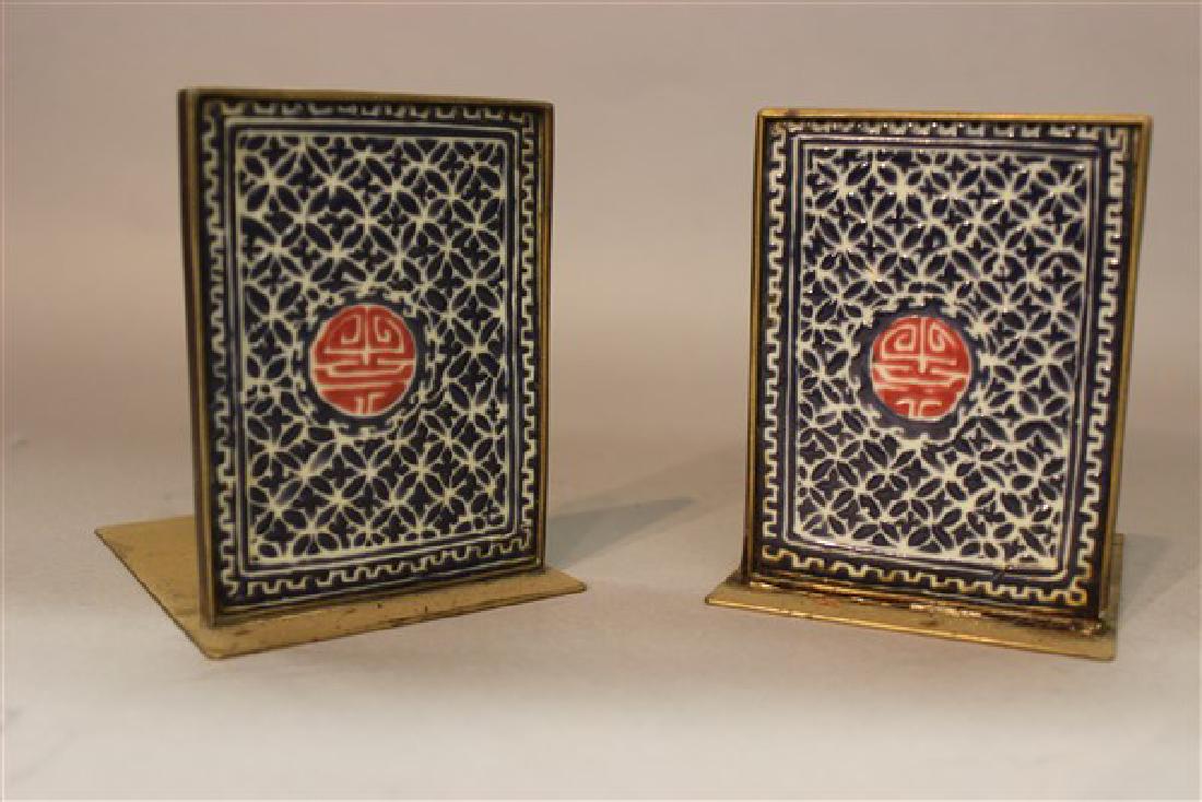 Chinese Tile Bookends: A pair of Chinese tile bookends. Early 20th century. Tiles are enamel painted in blue with red on white ground. Dimensions: 4 1/2 X 3"