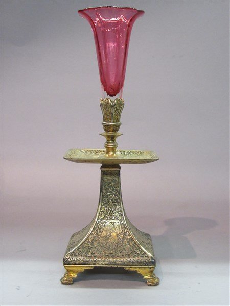 Mappin And Webb Silver Plated Pedestal Vase: A Mappin & Webb silver plated pedestal vase. Ornate Persian style motif with cranberry glass fluted vase. Dimensions: 10 3/4" X 3 3/4" X 3 3/4"