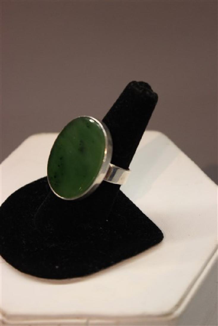 NE FROM Denmark Sterling Silver Modernist Design Ring: NE FROM, Denmark signed sterling silver modernist design ring with green oval inset stone. Size 8 Signed