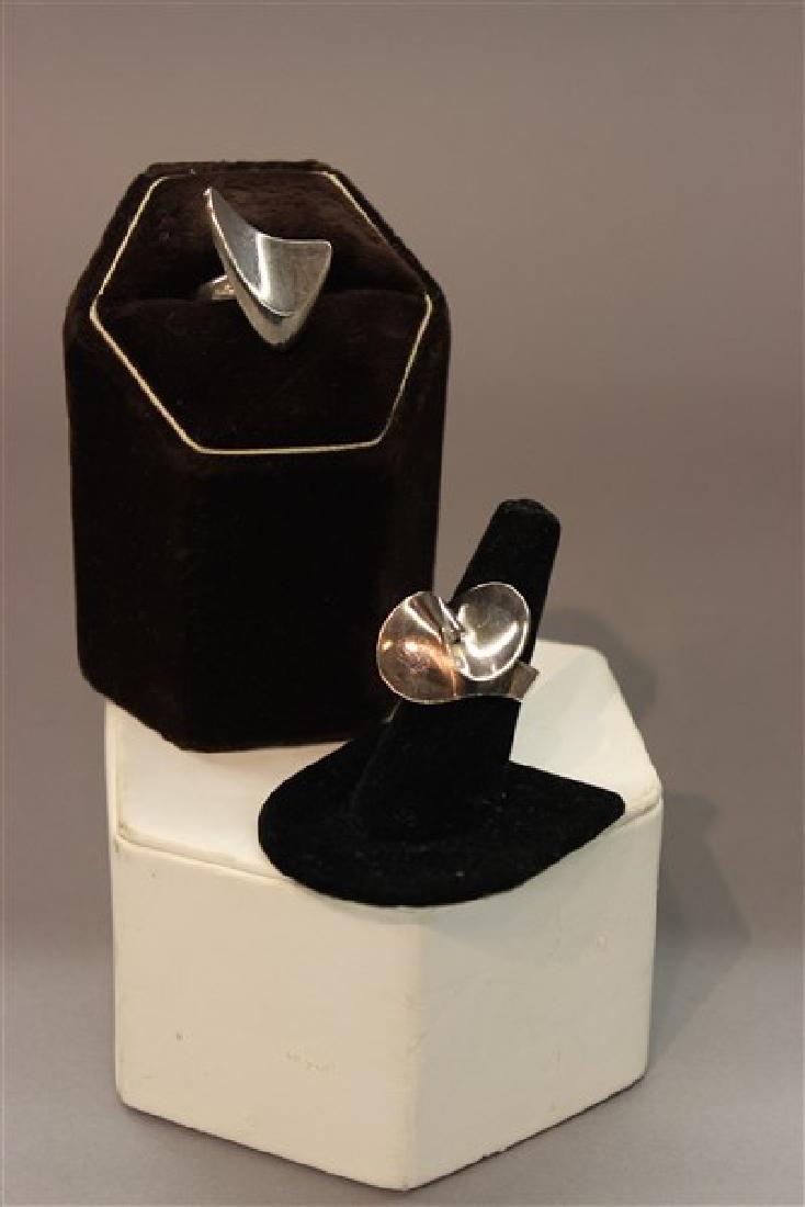Two (2) Vintage Georg Jensen Modernist Design Rings: Two (2) Georg Jensen modernist design rings. Design no. 120 (Henning Koppel) and 130. Size 8