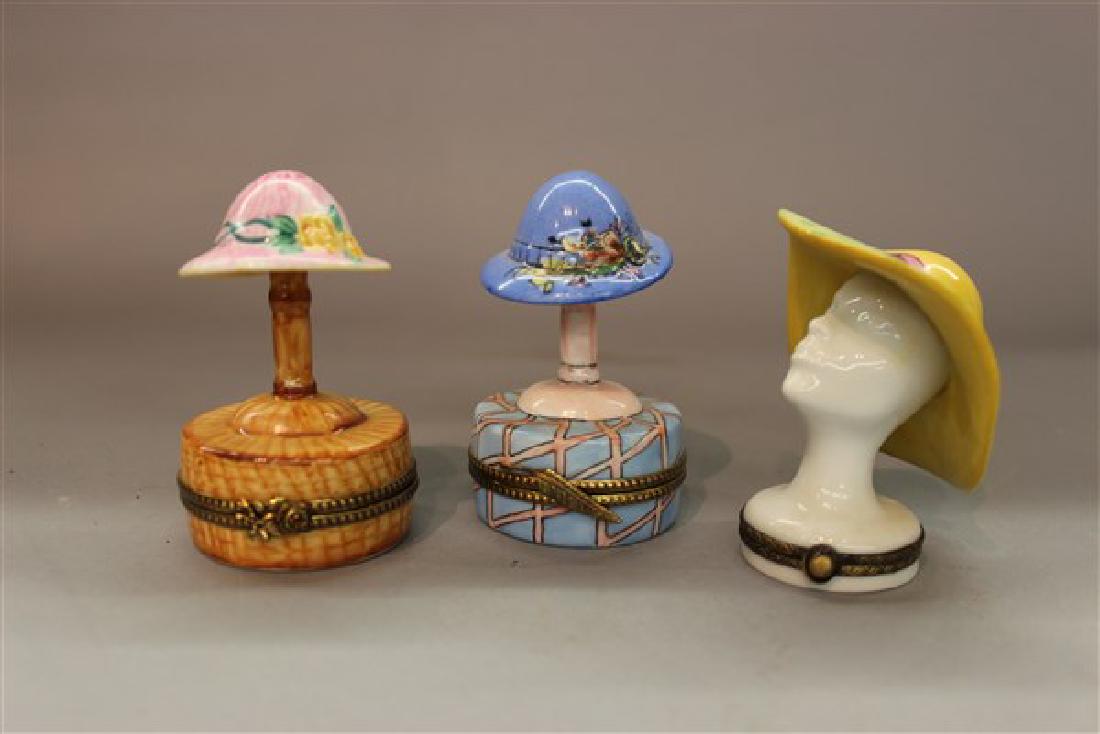 Three (3) Rochard, Limoges Porcelain Hat Boxes: Three (3) Rochard, Limoges porcelain hat boxes. Made in France. Dimensions: 3" -3 1/2" heights.