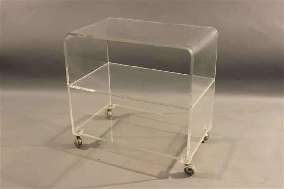 Lucite Tea Cart: A lucite tea cart.Dimensions: 26"h X 27"L X 17"d