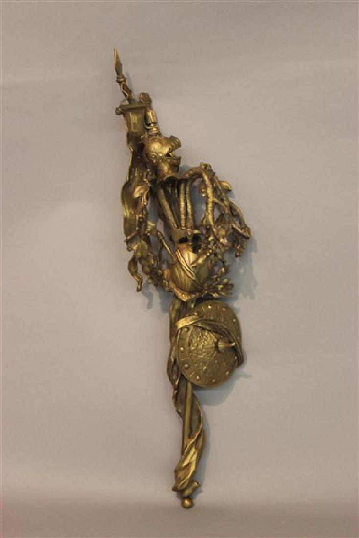19th C. French Bronze Armorial Wall Art: 19th c. French bronze mount with armor helmet, shield and weapons. Unsigned. Dimensions: 21" X 6"