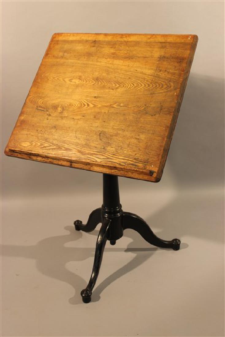 Cast Iron Adjustable Artist's Easel Table: An antique cast iron adjustable artist's easel table. Dimensions: 37 1/2" X 24" X 22"