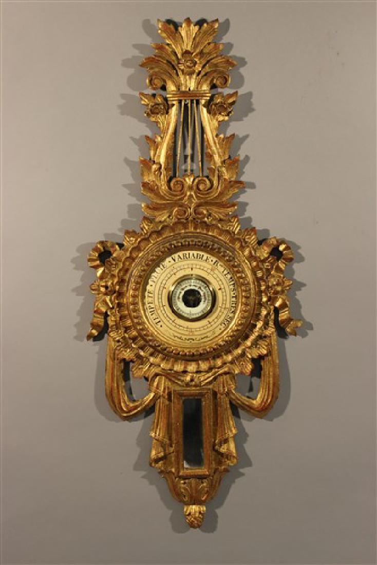 Large Italian Giltwood Barometer: A vintage Italian giltwood barometer. Dimensions: 40" X 16"