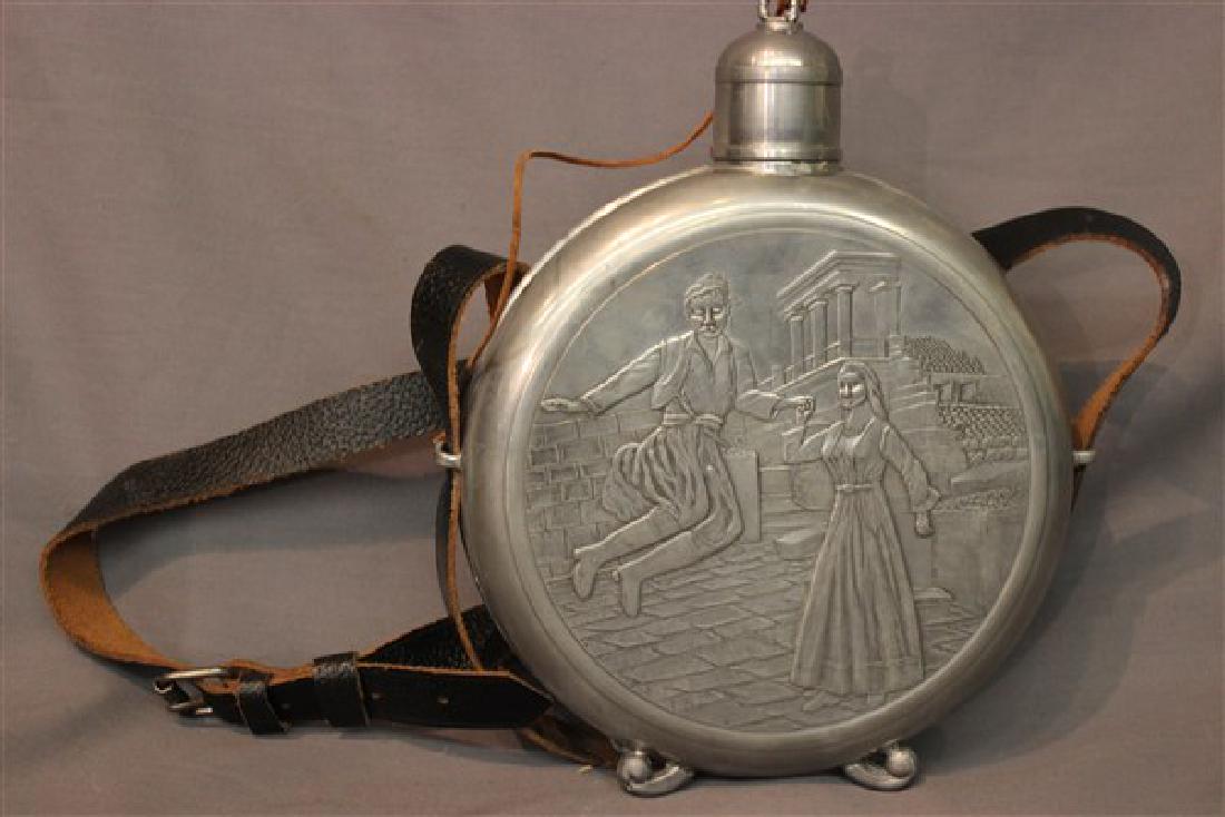 English Pewter Flask: An English pewter flask with engraved Greek landscapes. Dimensions: 9 1/2" X 8"
