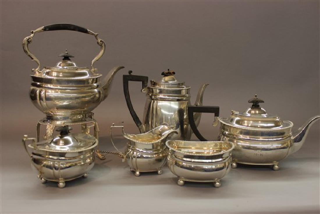 Tiffany English Sterling Silver Tea Service: A Six (6) piece Tiffany English silver tea service. Hallmarks for C.S. Harris & Co. , London. Includes Teapot, Hot water kettle, coffee pot, sugar, creamer and waste pot. Total weight: 8lbs 2 oz. or 1
