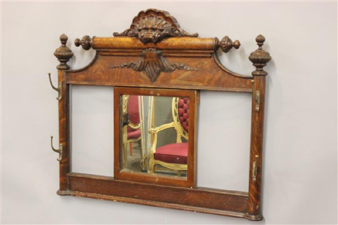 Victorian Carved Oak Hat Rack w/ Lion: A Victorian carved oak hat rack and mirror with carved lion.Dimensions: 35" X 32"