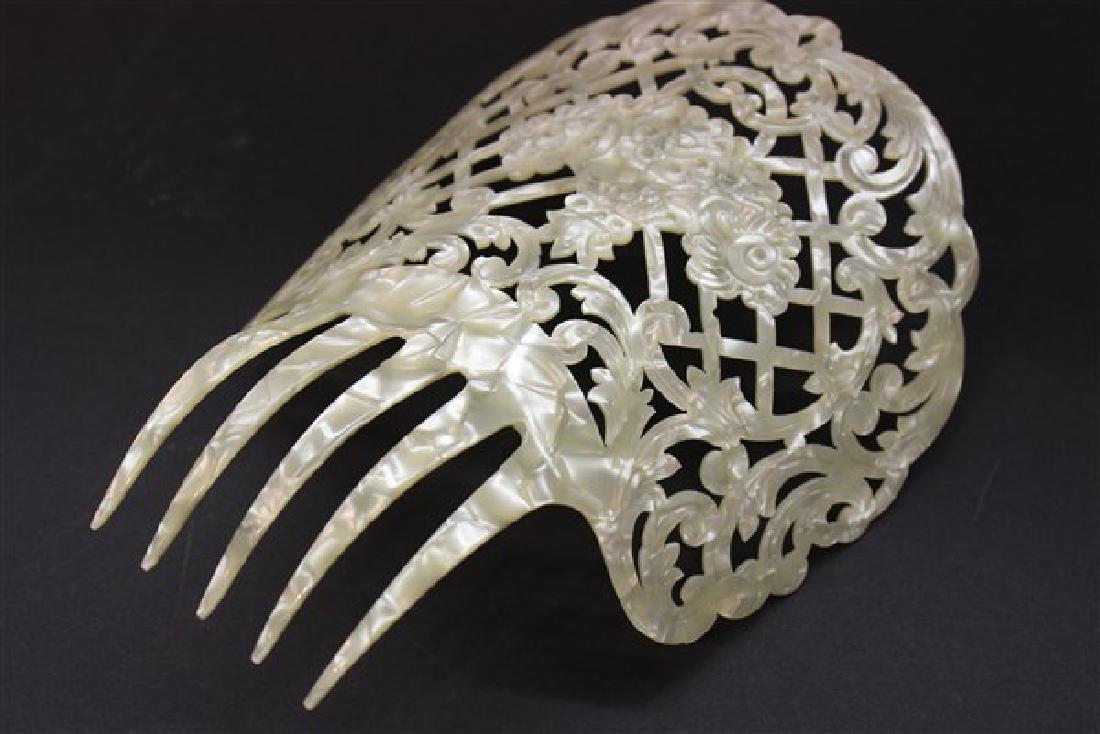 Large Art Deco Pearlized Antique Hair Comb: A fine Art Deco pearlized antique hair comb. Early plastic material. Excellent condition. Dimensions: 8 1/2" X 7 1/2"