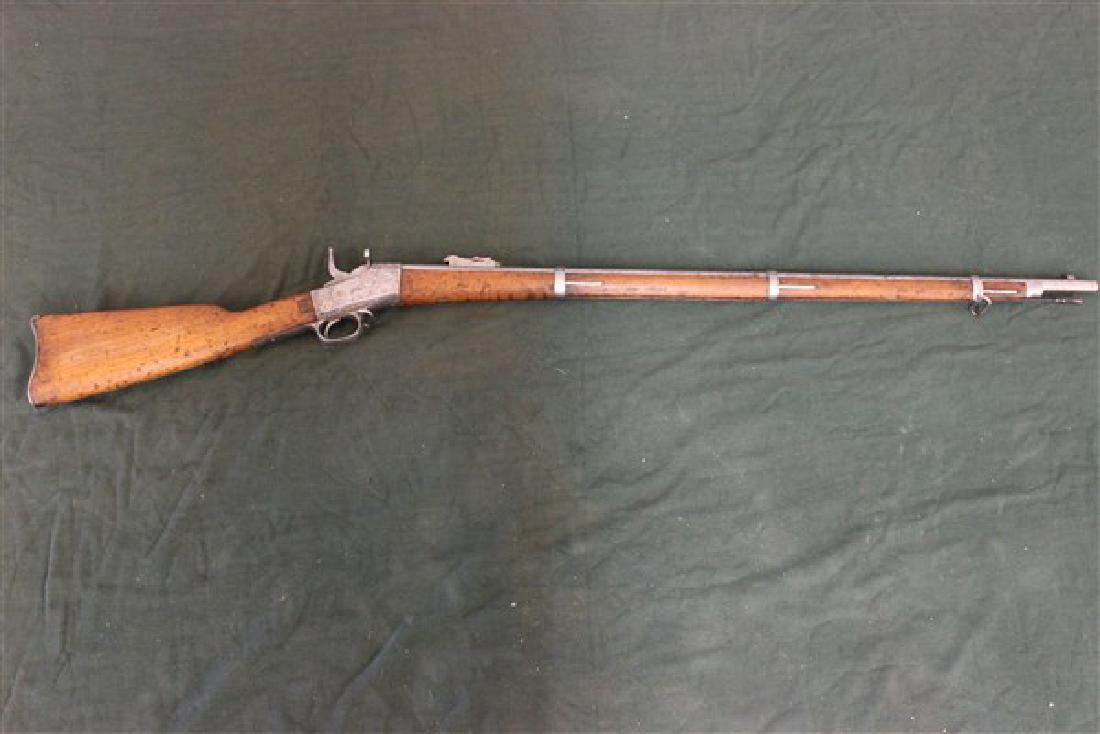 New Tork Model Remingtion Rolling Block Rifle: New York model remington rolling block rifle. Serial # 3f34 Dimension: 52"L