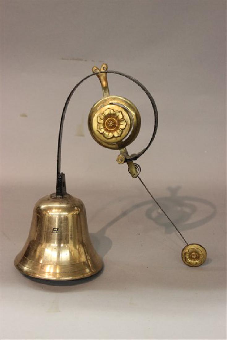 Antique Brass Country Store Door Bell: Antique brass country store door bell. Dimensions: 12" X 11 1/2" X 5" diameterProvenance: The collection of the late Mr. Paul Kramer, Chicago, IL.