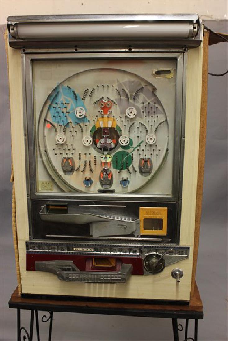 Two (2) Vintage Ginza Pachinko Machine: Ginza Pachinko MachinesDimensions: 33"h X 23"w X 18"d Units only.