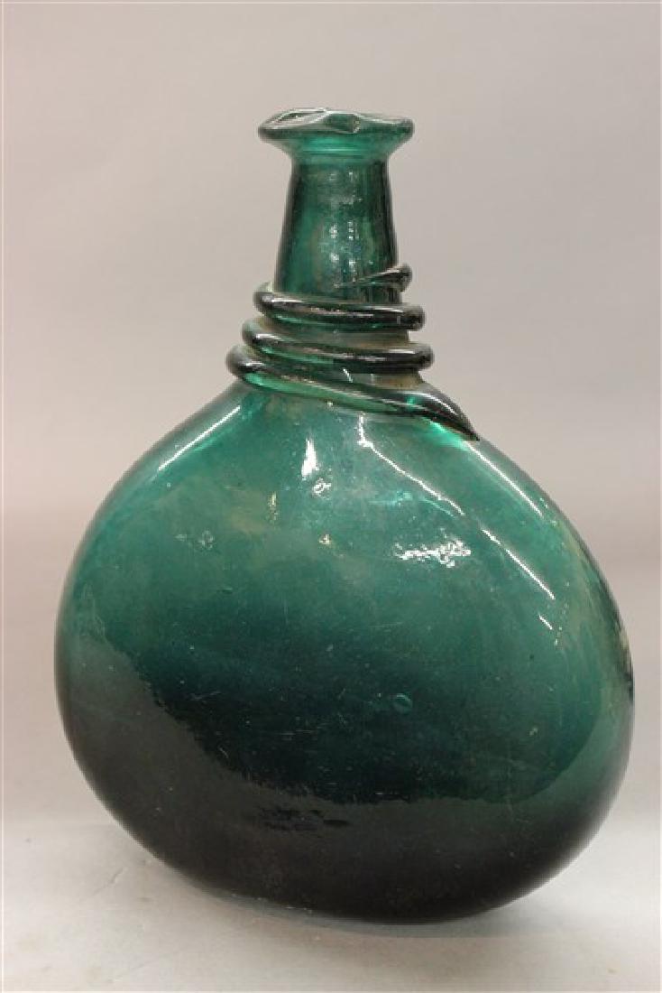 Green Blown Glass Bottle Flask: 19th c. green glass bottle flask with broken pontil mark. Dimensions: 9" X 7"