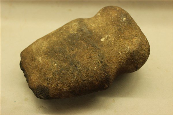 American Indian Stone Axe: An American Indian stone axe. Labeled "Found at foot 29th street E. River Manhattan"Dimensions: 6 1/2" X 4 1/4"