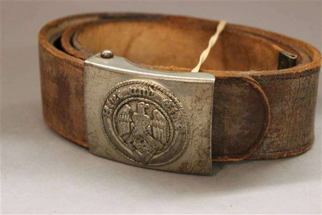 German WWII Hitler Youth Belt And Buckle: A German WW2 Hitler youth belt and buckle. Dimensions: 1 3/4" X 2 1/2" buckle