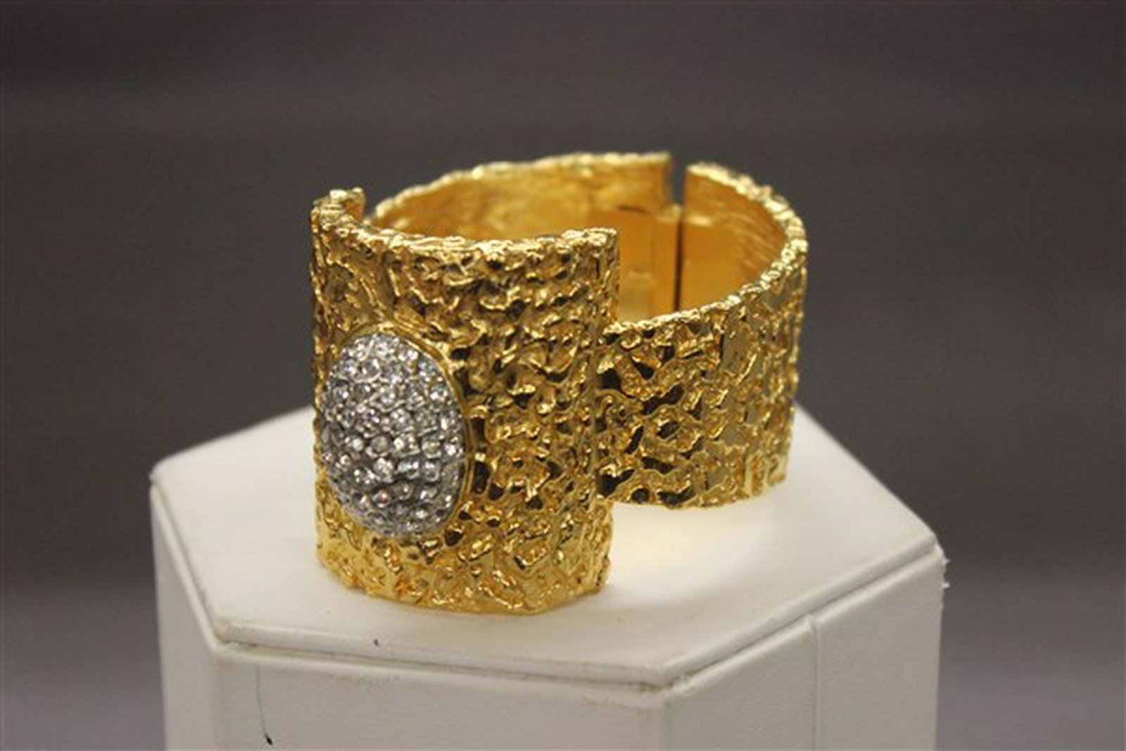 KJL Vintage Clamper Bracelet: A Kenneth J. Lane vintage gold tone clamper bracelet. Dimensions: 1 3/4" X 3 1/4"