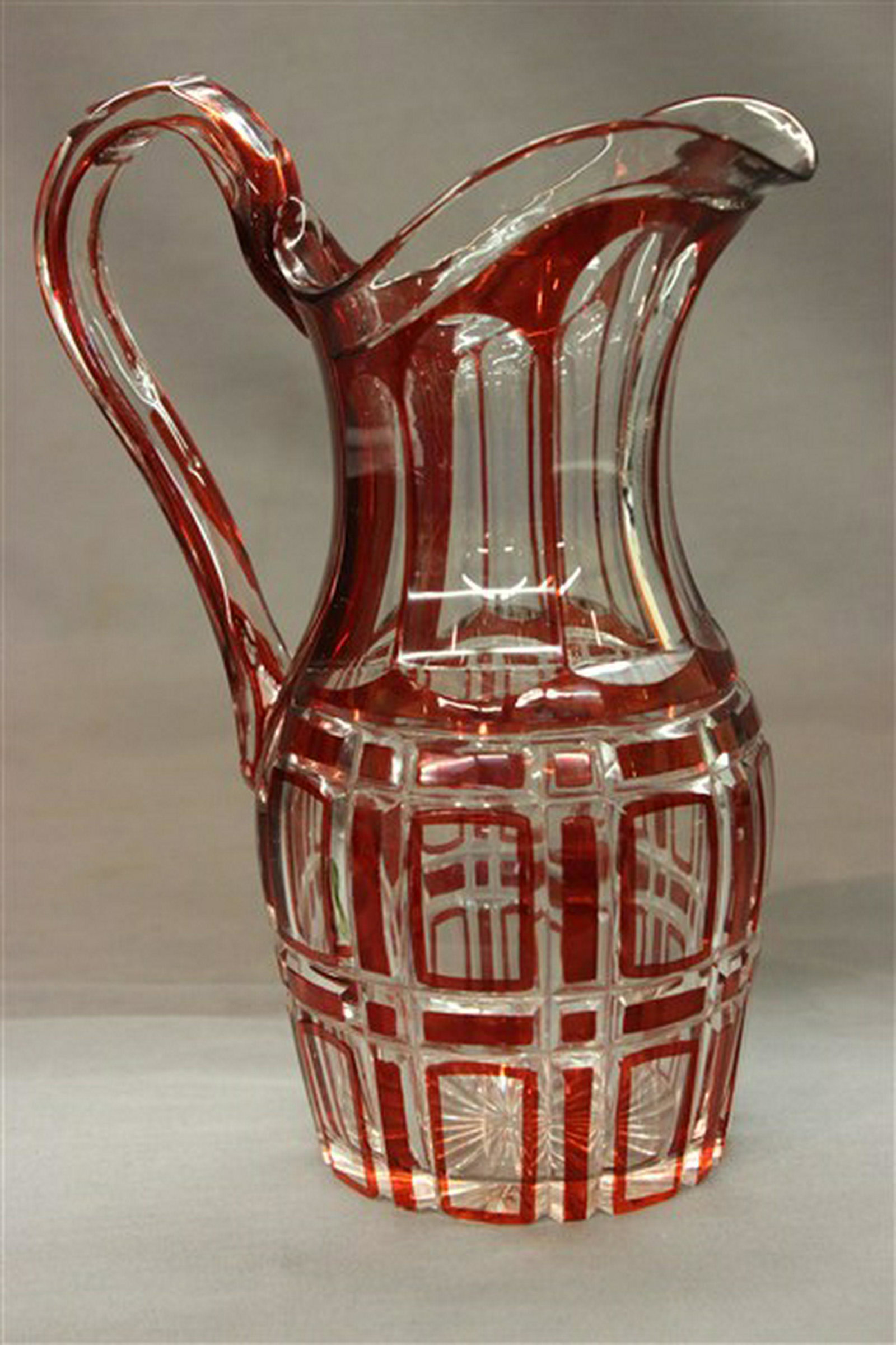 19th c. Ruby Flash Glass Pitcher: 19th century ruby flash glass pitcher. Dimensions: 9 3/4" X 7"
