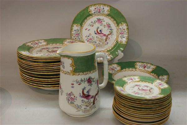 Thirty-Three (33) Piece Minton Cockatrice: A partial service of Minton Cockatrice china. Made in England 19th century.Thirty-Three (3) pieces total. Dimensions: 9" dinner plates, 5 3/4" bread plates, 9" bowl and 7 1/4" X 6 3/4" pitcher.
