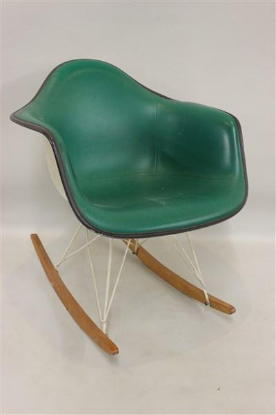 Eames Design Herman Miller Rocking Chair: Eames design Herman Miller rocking chair with green vinyl upholstery. Signed at base. Dimensions: 27" X 24" X 28"