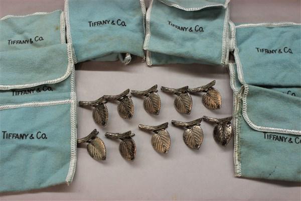 Tiffany & Co. Makers Sterling Silver Place Card Holders: A set of ten (10) Tiffany & Co. sterling silver place card holders in the form of a leaf and branch. Signed and individual felt bags for storage. Dimensions: 1" diametert.w.: 2.6 avg. oz.