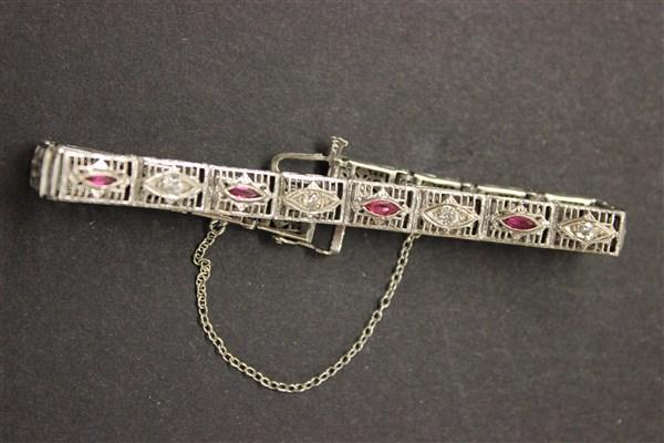 14k White Gold Filligree Edwardian Bracelet: 14k white gold filigree Edwardian bracelet. Five thin marquise red stones and Four (4) old European cut diamonds. Dimensions: 6 1/2" length Total weight: 7.5 grams